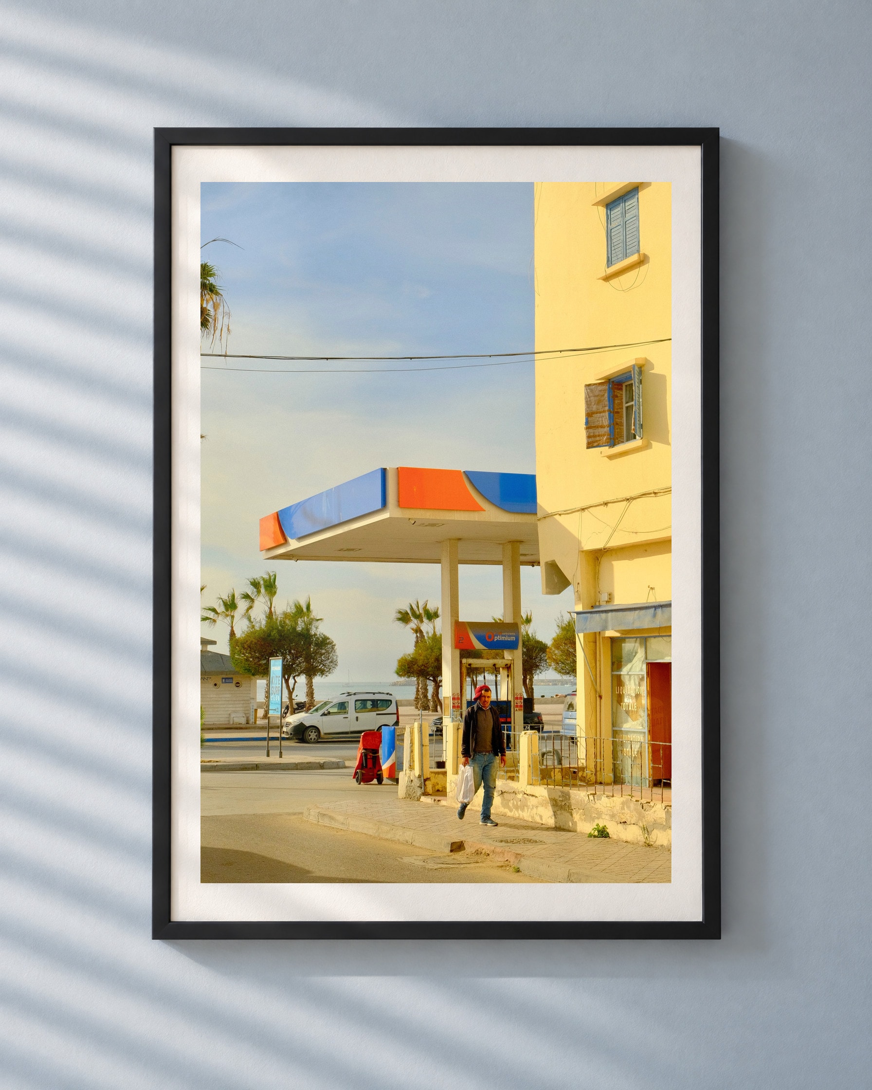 Gas Station Sea, framed print shown on a wall
