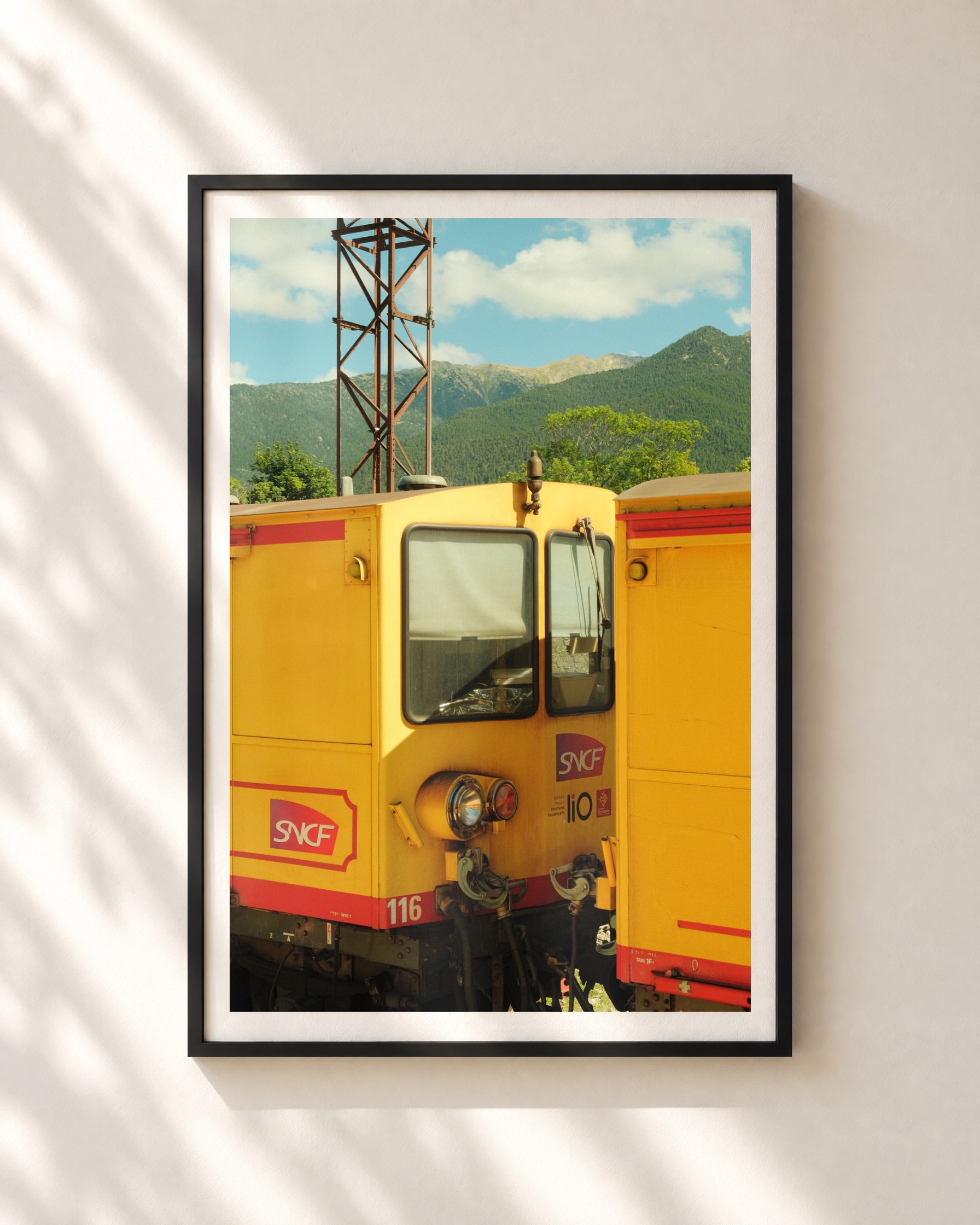 Le Train Jaune, framed print shown on a wall