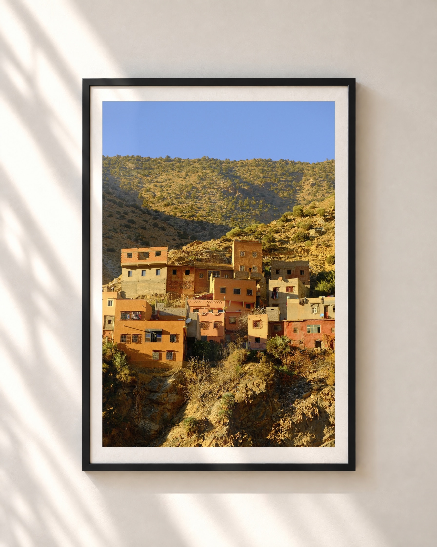 Mountain Village, framed print shown on a wall