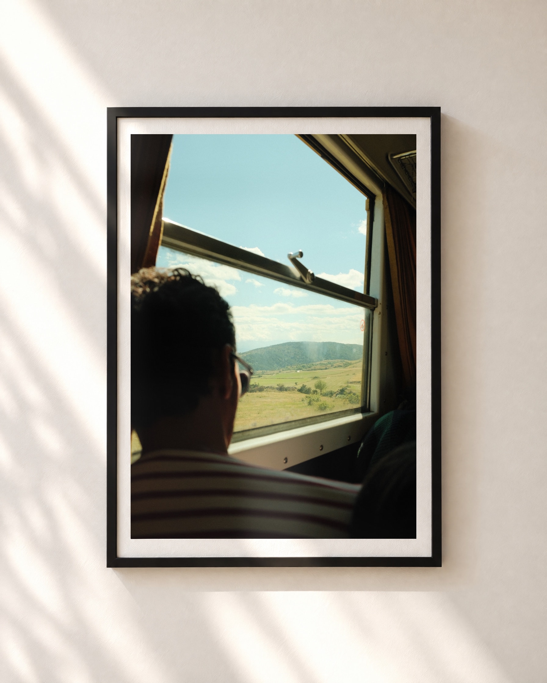 Window Seat, framed print shown on a wall